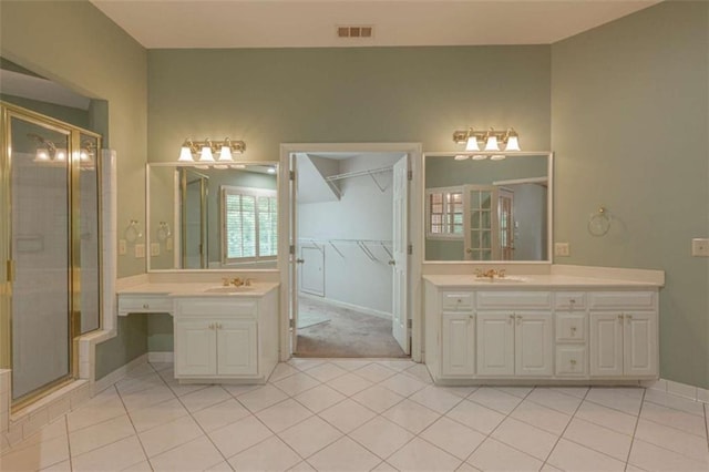 516 Turner Rd, Concord, GA 30206 - bathroom with two vanities, tile patterned flooring, and a shower stall