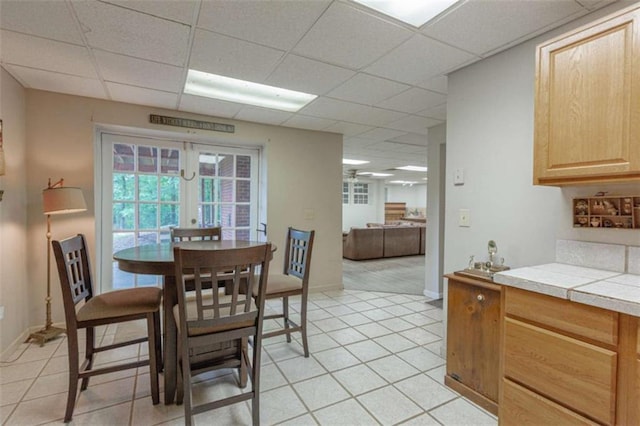 516 Turner Rd, Concord, GA 30206 - dining room with a drop ceiling, light tile patterned floors, and baseboards