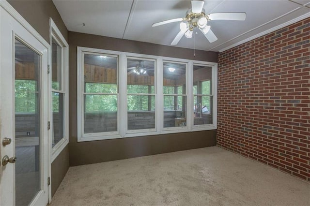516 Turner Rd, Concord, GA 30206 - unfurnished sunroom with brick wall and carpet floors