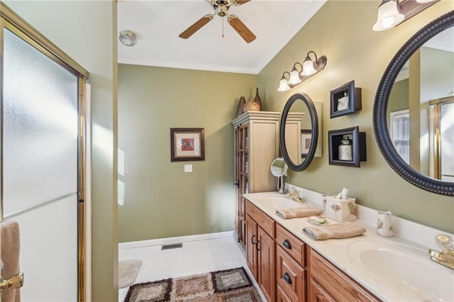 bathroom featuring ceiling fan, vanity, crown molding, a healthy amount of sunlight, and a shower with door