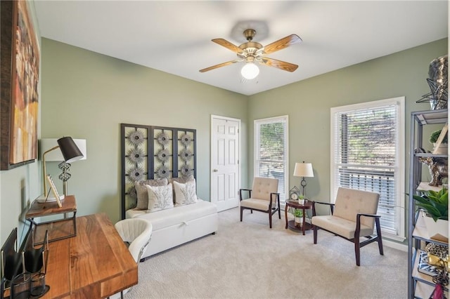 bedroom featuring ceiling fan and light colored carpet