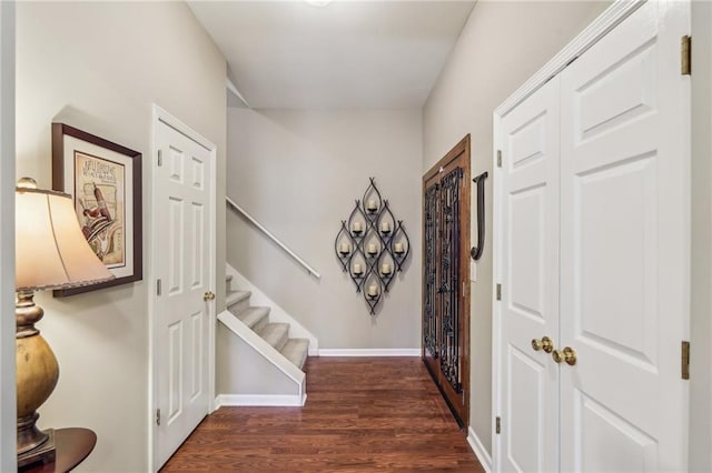 hallway with dark hardwood / wood-style floors