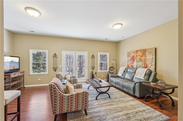 living room with dark hardwood / wood-style floors