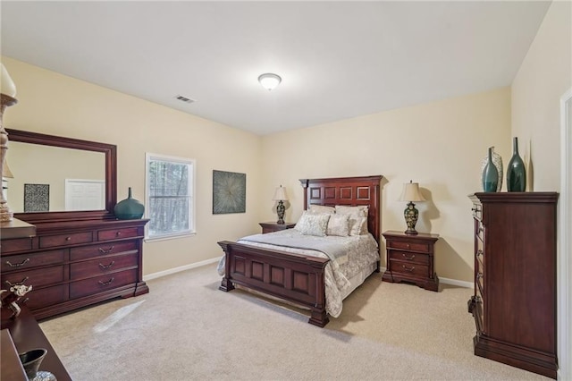 bedroom featuring light carpet