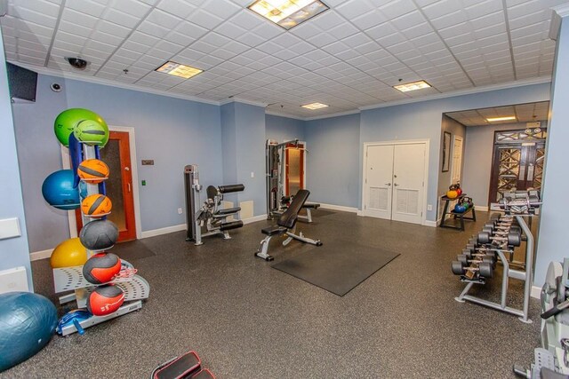 799 Hammond Dr Unit 406, Atlanta, GA 30328 - workout area with a paneled ceiling, crown molding, and baseboards