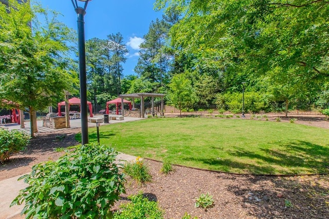 799 Hammond Dr Unit 406, Atlanta, GA 30328 - view of yard with fence and a pergola