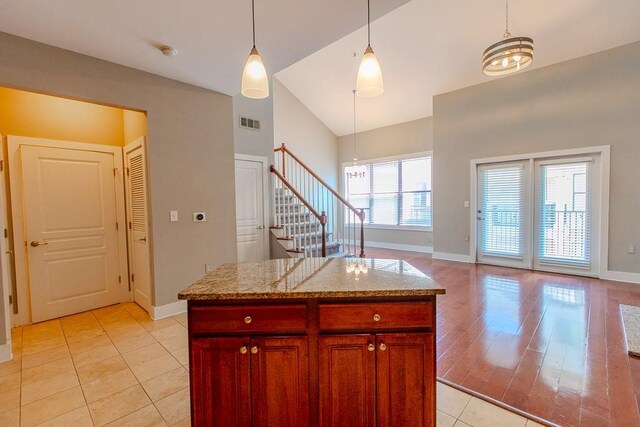 799 Hammond Dr Unit 406, Atlanta, GA 30328 - kitchen featuring decorative light fixtures, light tile patterned flooring, baseboards, and visible vents
