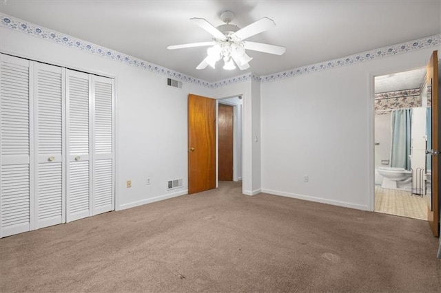 unfurnished bedroom with baseboards, carpet flooring, and visible vents