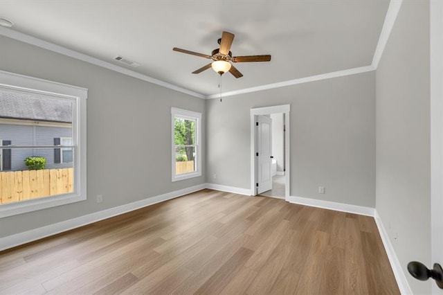 231 E Marable St, Monroe, GA 30655 - unfurnished room with wood finished floors, ceiling fan, baseboards, and crown molding