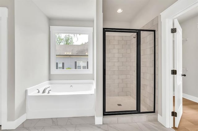231 E Marable St, Monroe, GA 30655 - bathroom featuring a garden tub, a shower stall, baseboards, marble finish flooring, and recessed lighting