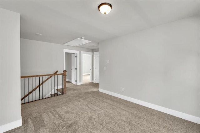 231 E Marable St, Monroe, GA 30655 - carpeted spare room featuring attic access and baseboards