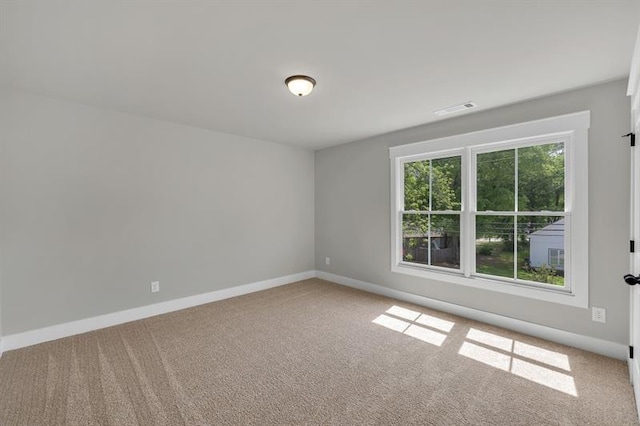 231 E Marable St, Monroe, GA 30655 - carpeted empty room featuring baseboards