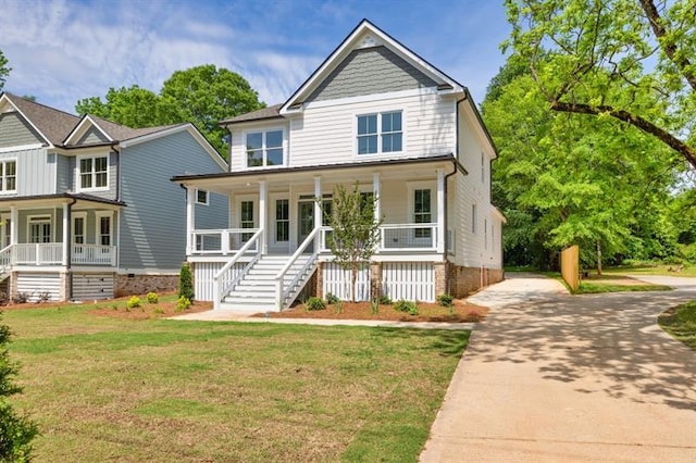 231 E Marable St, Monroe, GA 30655 - view of front of home with covered porch, driveway, stairway, and a front yard