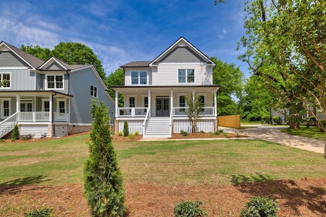 231 E Marable St, Monroe, GA 30655 - view of front of house with covered porch, stairway, and a front yard