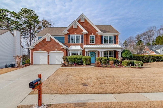 view of front of house featuring a garage and a front yard