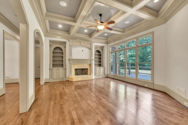 9145 Greenway Ct, Gainesville, GA 30506 - unfurnished living room featuring a ceiling fan, crown molding, light wood-style floors, coffered ceiling, and a fireplace