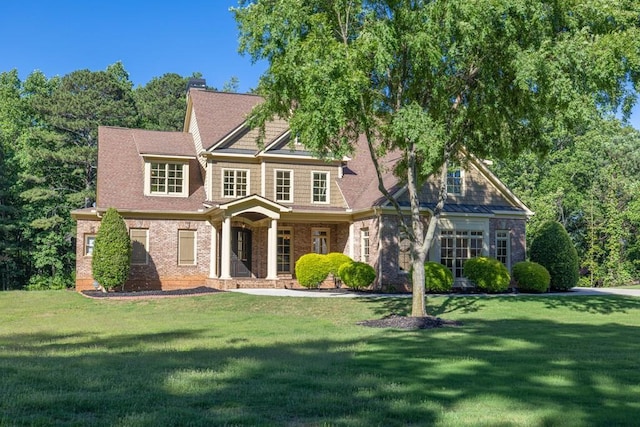 9145 Greenway Ct, Gainesville, GA 30506 - view of front of property with a front yard, brick siding, a chimney, and a porch