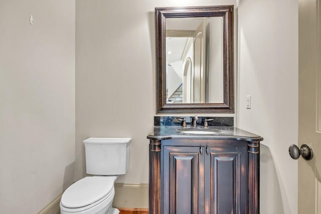 9145 Greenway Ct, Gainesville, GA 30506 - bathroom with toilet, vanity, and baseboards