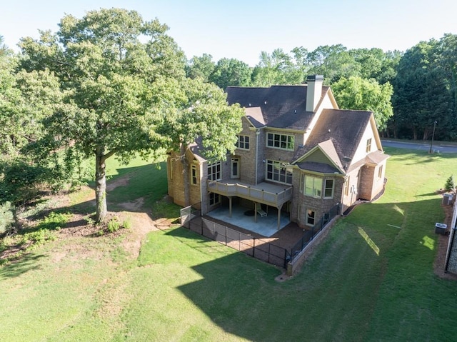 9145 Greenway Ct, Gainesville, GA 30506 - back of house featuring a wooden deck, a chimney, and a lawn