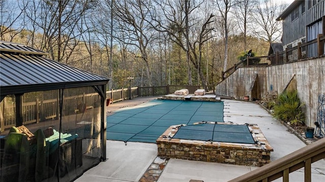 view of pool with a patio area, a fenced backyard, a jacuzzi, and a fenced in pool