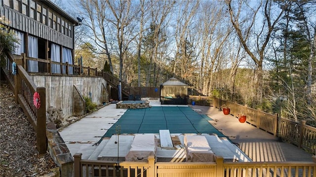 view of pool featuring a fenced in pool and a gazebo