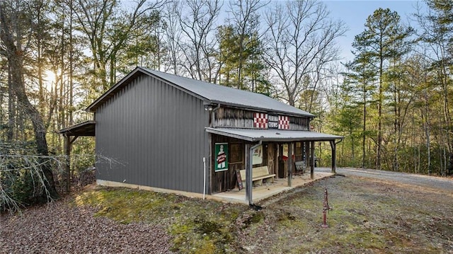 view of outdoor structure featuring covered porch