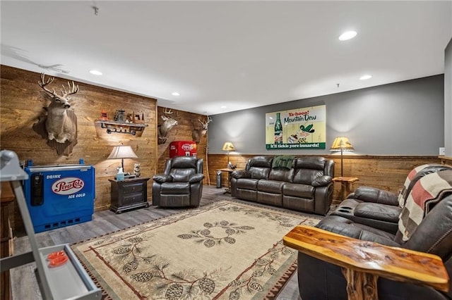 living room featuring a wainscoted wall, recessed lighting, and wooden walls