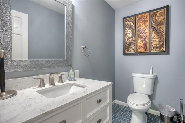 bathroom featuring tile patterned floors, vanity, and toilet