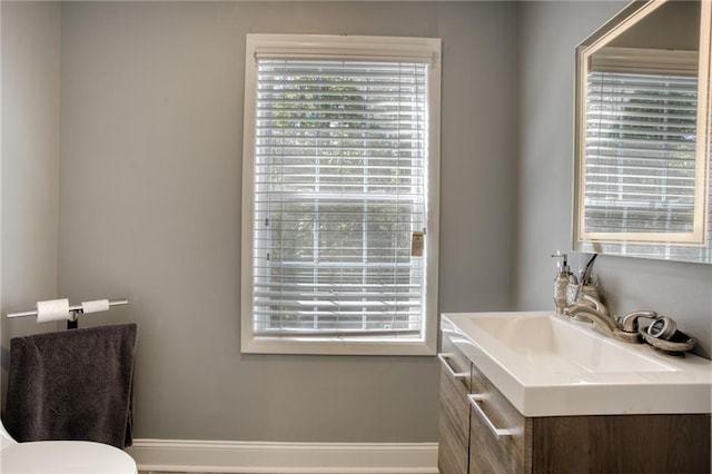 bathroom with vanity and toilet