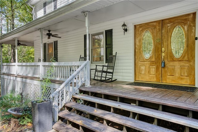 doorway to property with covered porch and ceiling fan