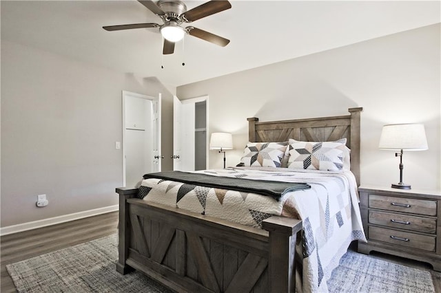 bedroom featuring ceiling fan, baseboards, and dark wood-style floors