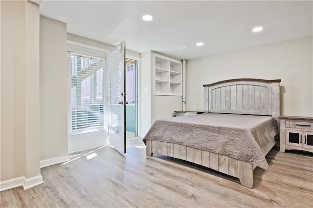 bedroom featuring recessed lighting, baseboards, and wood finished floors