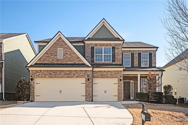 craftsman-style home with a garage and central AC unit