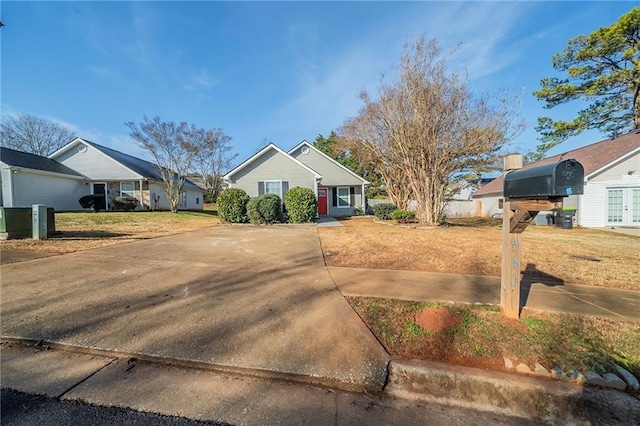 single story home with a front lawn