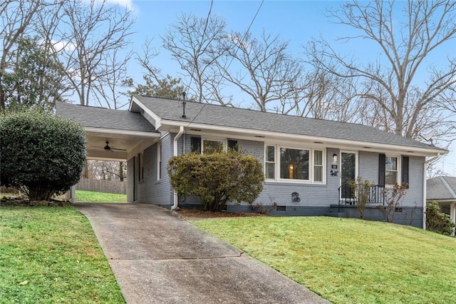 ranch-style home with brick siding, roof with shingles, a carport, driveway, and a front lawn