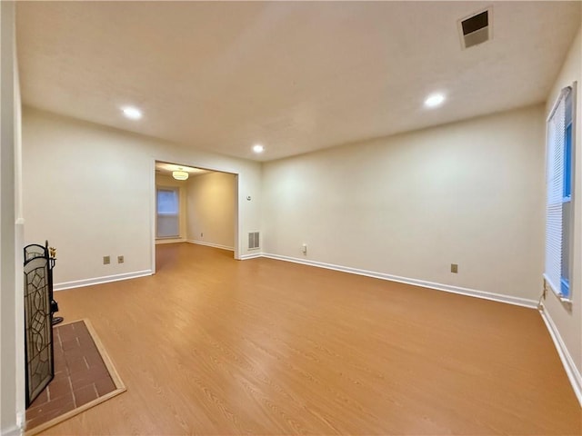 interior space with recessed lighting, visible vents, baseboards, and wood finished floors