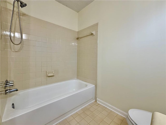 full bathroom featuring shower / bath combination, baseboards, toilet, tile patterned floors, and a textured ceiling