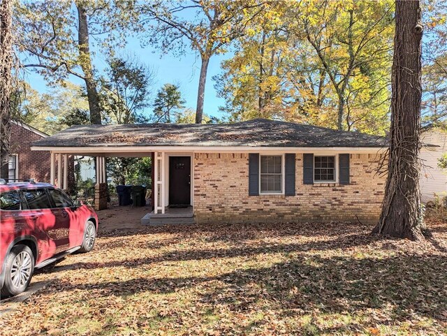 single story home with brick siding