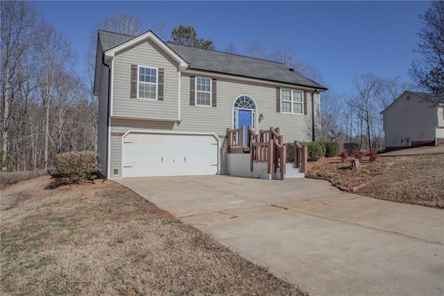 bi-level home featuring a garage