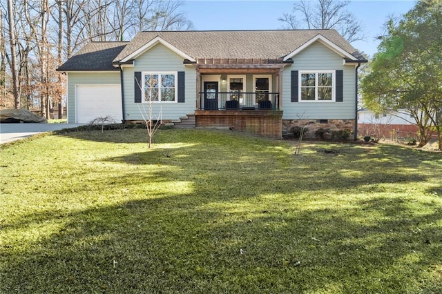 single story home with a porch, a garage, and a front yard