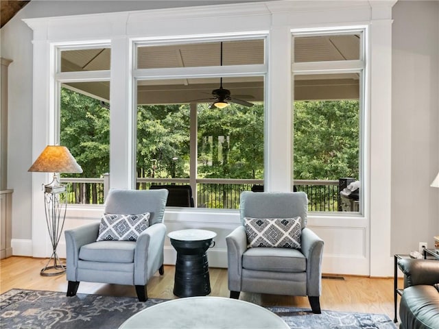 sunroom / solarium with ceiling fan