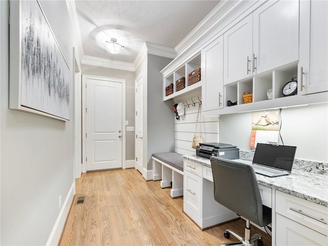 office space featuring ornamental molding and light hardwood / wood-style floors