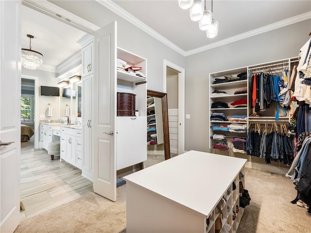 spacious closet with light carpet and a notable chandelier