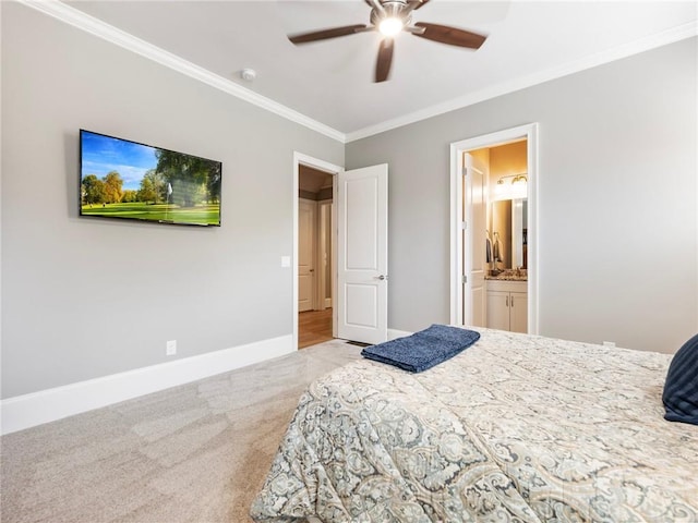 carpeted bedroom with ornamental molding, connected bathroom, and ceiling fan