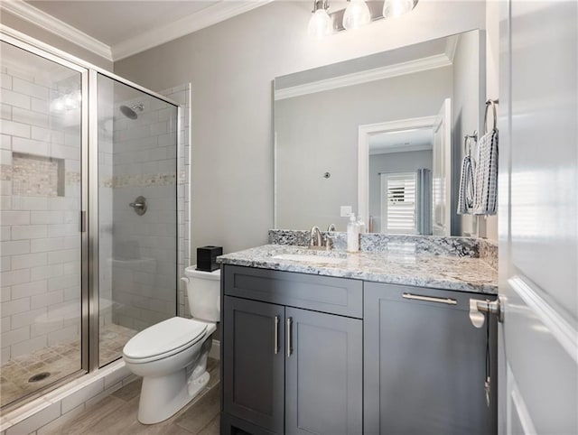 bathroom with crown molding, vanity, and walk in shower