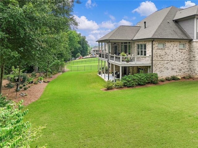 view of yard with a wooden deck and a patio area