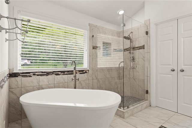 185 Lee Path, Acworth, GA 30102 - bathroom with tile walls, a stall shower, a freestanding bath, and marble finish flooring