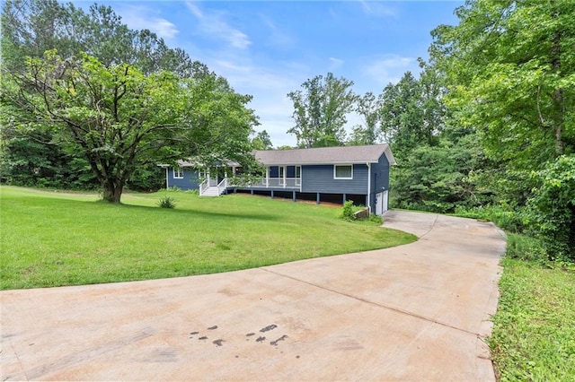 185 Lee Path, Acworth, GA 30102 - view of front of house with concrete driveway, a front lawn, a garage, and a wooden deck