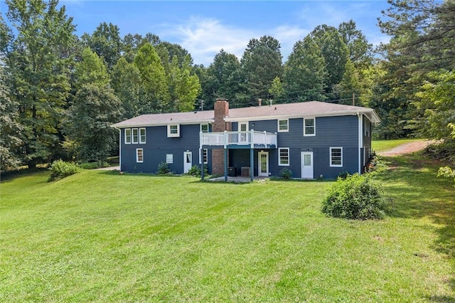 185 Lee Path, Acworth, GA 30102 - back of property with a yard, a chimney, a wooden deck, and a wooded view