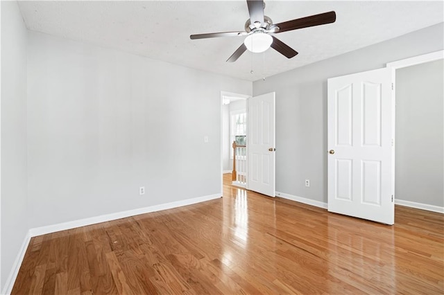 unfurnished bedroom featuring ceiling fan and hardwood / wood-style floors